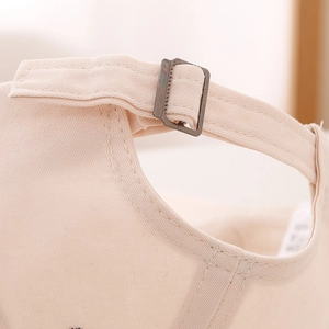 Adjustable canvas back strap and metal buckle detail on a cute bear baseball cap