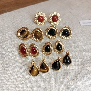 Vintage retro tiger eye agate stud earrings set in various geometric drop shapes