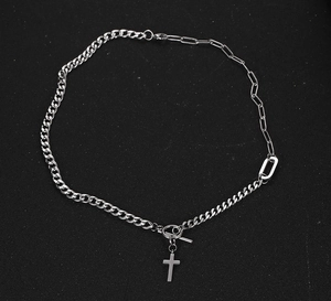 Detail of silver titanium steel cross necklace with cuban and paperclip mixed chain