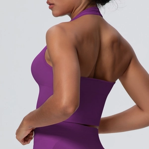 Detailed back view of a dark purple halter yoga bra featuring breathable seamless fabric