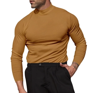 Detail of mustard yellow slim-fit mock neck long sleeve shirt on model focusing on fabric