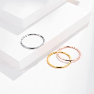 Minimalist stackable 1mm stainless steel rings in silver, gold, and rose gold finish
