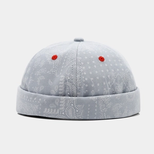 Blue paisley miki hat with red embroidery details and adjustable brimless street design