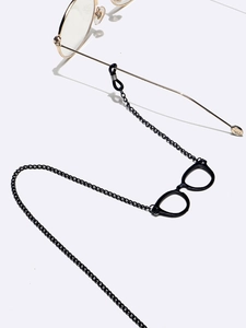 Detail of black metal glasses chain with mini glasses charm and anti-slip rubber ends