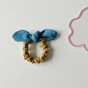 Plush bicolor rabbit ear hair scrunchie in blue and yellow velvet for girl hair styling