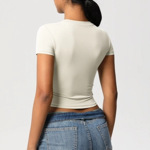 Detailed back view showing the slim fit and high-stretch fabric of the oatmeal yoga t-shirt