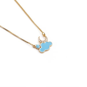 Cartoon moon and blue cloud pendant necklace in golden finish on a clean white background