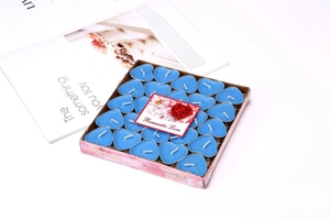 Detailed view of 50-pack blue heart-shaped tea light candles in a romantic gift box