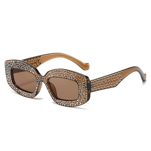 Sparkly rhinestone cat eye sunglasses with brown lenses and amber crystal frames