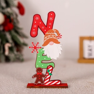 Detailed view of NOEL wooden Christmas table decor with gingerbread man and gnome characters