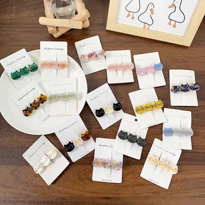 Three-cat acetate hair clip set in assorted glitter and marble finishes on card