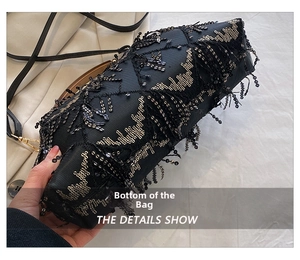 Detail view showing sequin wave patterns and black tassels on the bottom of the evening bag