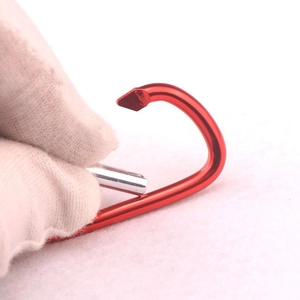 Red D-ring aluminum carabiner keychain held by hand for outdoor water bottles and gear