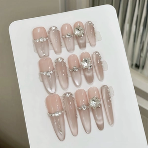 Luxury handmade press-on nails with cat eye effect and sparkling crystal rhinestones