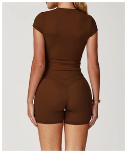 Close-up of V-shaped back stitching on high-waist chocolate brown yoga shorts