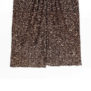 Elegant bronze sequin dress with shoulder pads and side slit for a stylish formal look