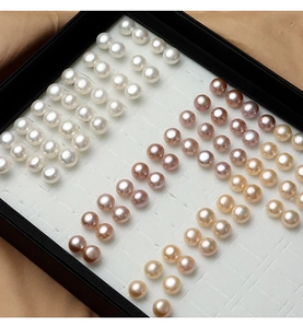Close-up of white, purple, and champagne natural freshwater pearls for S925 silver studs