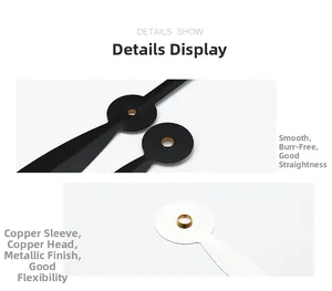 Detail of metal clock hands with copper bushings showing smooth finish and precision design