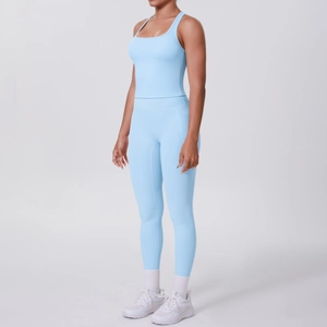 Light blue two-piece yoga set with racerback tank top and high-waisted side pocket leggings
