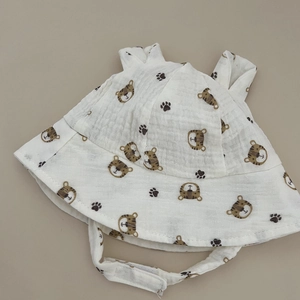 Detail of baby cotton sun hat featuring tiger prints, 3D ears and adjustable chin strap