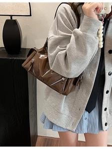 Retro brown glossy faux leather crossbody bag with motorcycle style and metal zippers