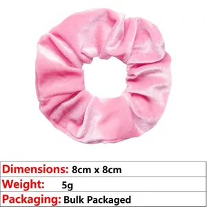 Pink velvet scrunchie detail showing 8cm x 8cm size and 5g weight on white background