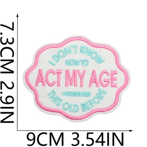 Macro shot of embroidered patch with funny quote and detailed stitch texture