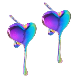 Macro shot of heart-shaped earrings with iridescent aurora metallic coating