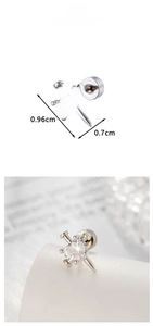 Detail view of heart-shaped zircon earrings with cross design and size measurements