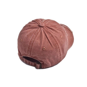 Rear view of distressed baseball cap showing metal buckle adjustment and ripped brim