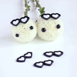 Detailed view of five heart-shaped miniature resin sunglasses for DIY crafts and dolls