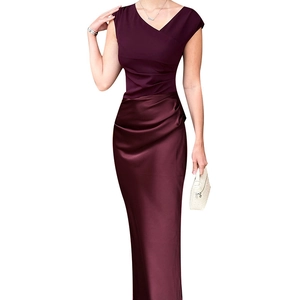 Detail of the elegant dark purple dress showing contrast between matte top and satin skirt