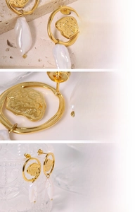 Detail of 18K gold plated Baroque natural pearl earrings with handmade texture