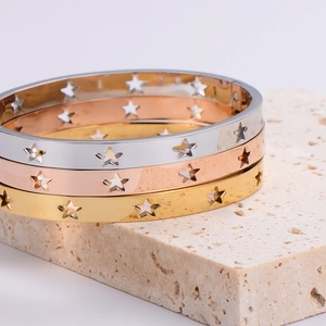 Hollow out star pattern bangles in silver, rose gold, and gold on stone base