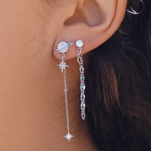Close-up of S925 sterling silver tassel star earrings with sparkling crystals on model