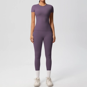 Front view of a purple high-waisted yoga leggings and tight short-sleeve top set