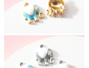 Detailed macro shot of colorful elephant charms with enamel finish and metal hanging loops