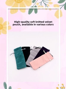 Detailed close-up of soft velvet drawstring pouches for jewelry in various elegant colors