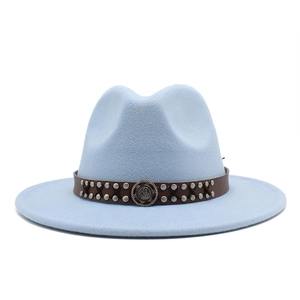 Detail of light blue wool fedora featuring a leather strap with silver studs and badge