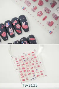 Dettaglio di adesivi per nail art 3D con disegni di ciliegie, conigli e fiocchi su unghie grigie