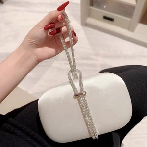 Elegant pearl white satin evening clutch bag with sparkling rhinestone handle for weddings