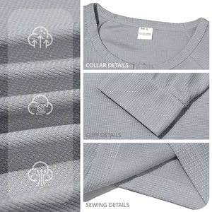 Macro detail of breathable waffle fabric texture, neckline, cuffs and stitching on men's shirt