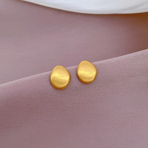Minimalist egg-shaped gold titanium steel stud earrings with matte frosted finish