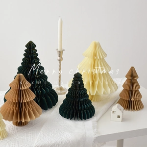 Minimalist paper honeycomb Christmas tree decorations in cream, green, and tan shades