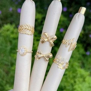 Detailed view of 6-piece gold-plated ring set with zircons in a garden setting