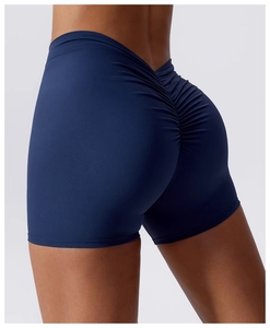 Close-up of deep blue high-waisted yoga shorts with scrunch butt lifting and V-cut waist