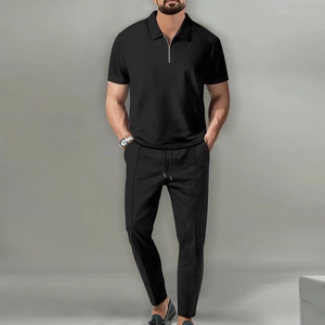 Close-up detail of premium black waffle knit fabric texture on men polo and pants set