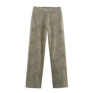 Olive green high-waisted wide-leg trousers with intricate sunflower eyelet embroidery