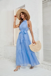 Detail of light blue halter neck maxi dress featuring tiered ruffles and grid texture