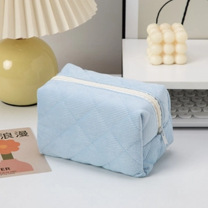 Light blue diamond quilted corduroy cosmetic bag with high capacity zipper storage